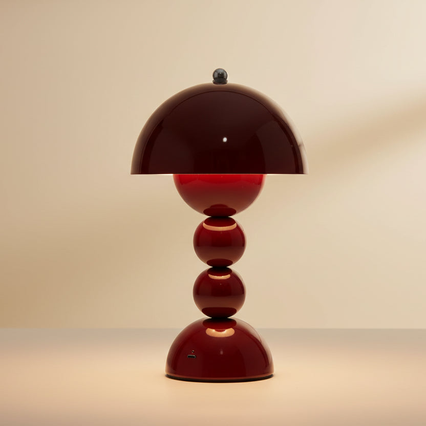 Red table lamp with a white background